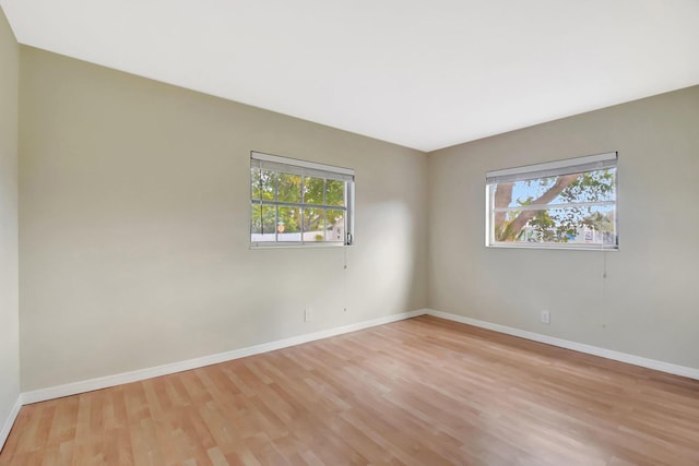 1103 NW 7th Ct, Boynton Beach, FL 33426 - unfurnished room with light wood finished floors and baseboards
