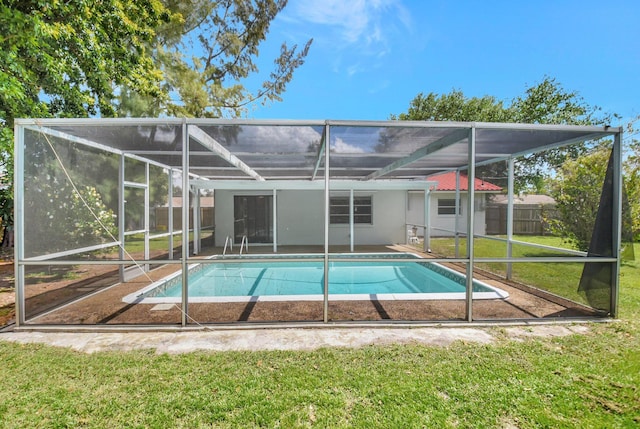 1103 NW 7th Ct, Boynton Beach, FL 33426 - rear view of house featuring glass enclosure, an outdoor pool, and a patio