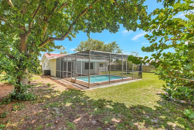 1103 NW 7th Ct, Boynton Beach, FL 33426 - rear view of property featuring an outdoor pool, stucco siding, and a lanai