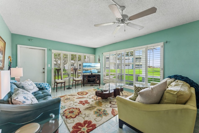 1470 S Ocean Blvd Unit 301, Pompano Beach, FL 33062 - tiled living area with plenty of natural light, ceiling fan, and a textured ceiling