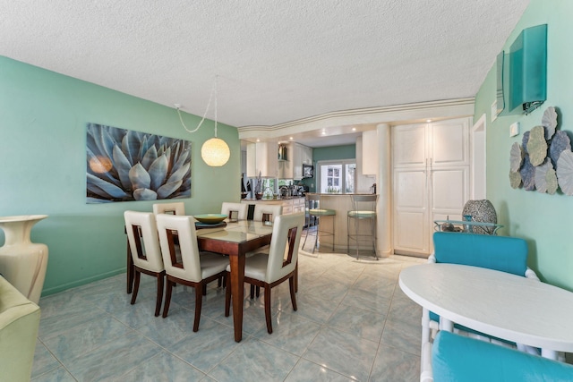 1470 S Ocean Blvd Unit 301, Pompano Beach, FL 33062 - dining area featuring a textured ceiling