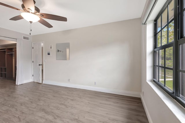 3118 Florida Blvd Unit 204-B, Delray Beach, FL 33483 - unfurnished room with healthy amount of natural light, baseboards, wood finished floors, and a ceiling fan