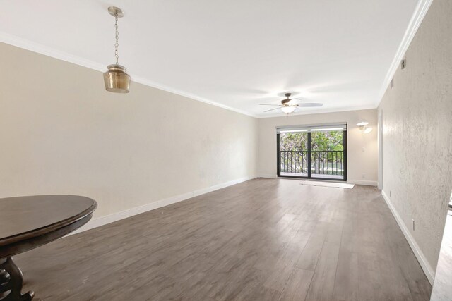 3118 Florida Blvd Unit 204-B, Delray Beach, FL 33483 - unfurnished living room featuring ceiling fan, wood finished floors, crown molding, and baseboards