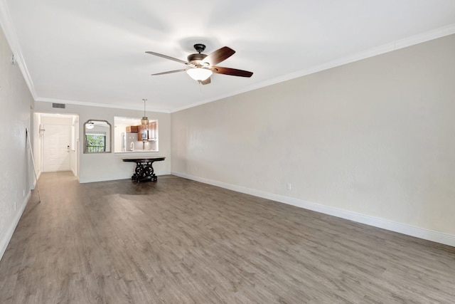 3118 Florida Blvd Unit 204-B, Delray Beach, FL 33483 - unfurnished living room with ceiling fan, wood finished floors, crown molding, and baseboards