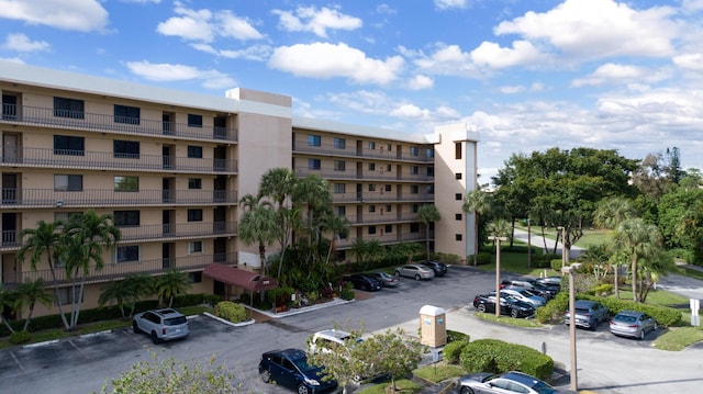 7770 Tahiti Ln Unit 408, Lake Worth, FL 33467 - view of apartment building / complex featuring uncovered parking