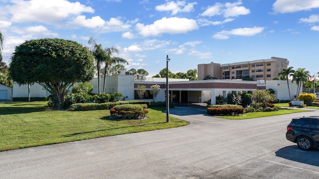 7770 Tahiti Ln Unit 408, Lake Worth, FL 33467 - view of property with uncovered parking