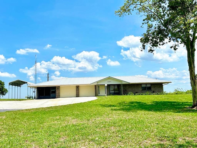 2657 River Rd, Moore Haven, FL 33471 - single story home featuring a garage, concrete driveway, brick siding, and a front yard