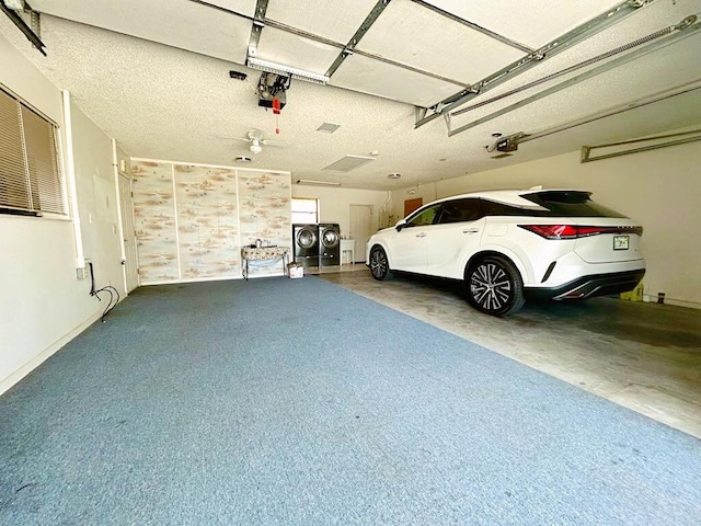 2657 River Rd, Moore Haven, FL 33471 - garage with a garage door opener, washer and clothes dryer, and baseboards