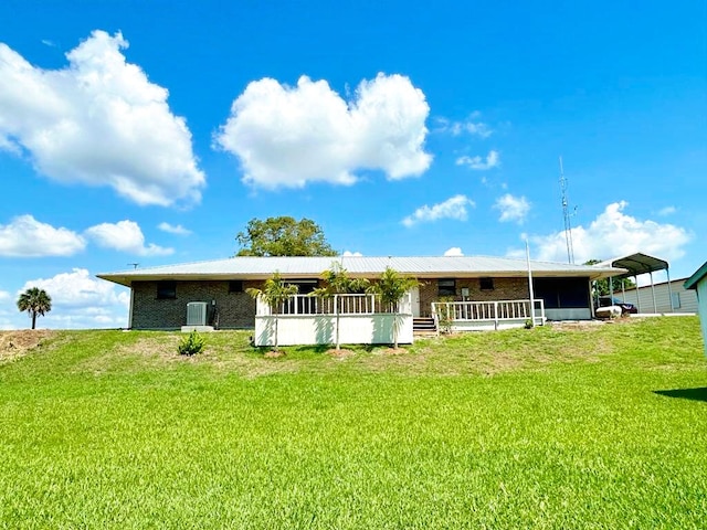 2657 River Rd, Moore Haven, FL 33471 - back of house featuring cooling unit and a yard