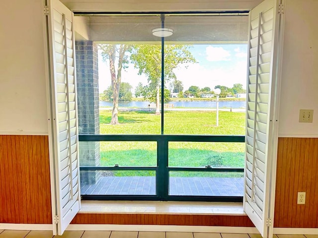 2657 River Rd, Moore Haven, FL 33471 - entryway with a water view, a wainscoted wall, and wood walls