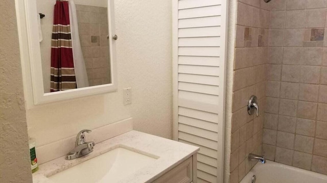 1512 Florida Ave Unit 1/2, West Palm Beach, FL 33401 - full bathroom featuring vanity, a textured wall, and shower / bathtub combination with curtain