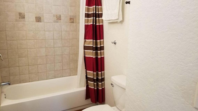 1512 Florida Ave Unit 1/2, West Palm Beach, FL 33401 - bathroom with toilet, a textured wall, and shower / bath combo with shower curtain
