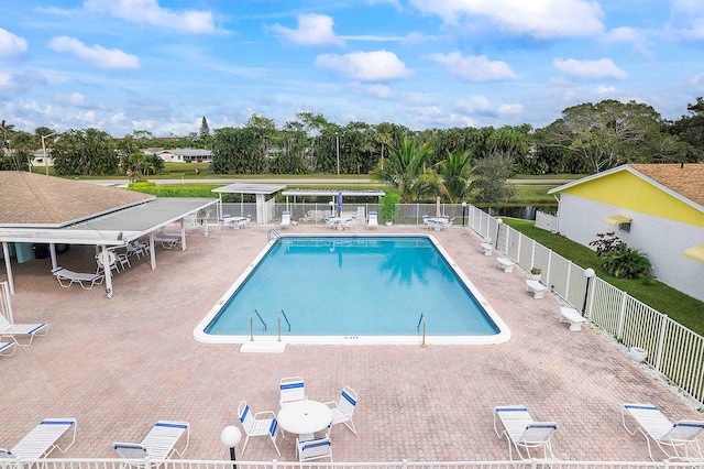 14444 Campanelli Dr, Delray Beach, FL 33484 - community pool featuring view of scattered trees and a patio area