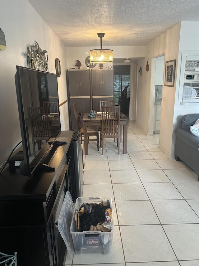 132 Berkshire F, West Palm Beach, FL 33417 - dining space featuring a textured ceiling and a chandelier