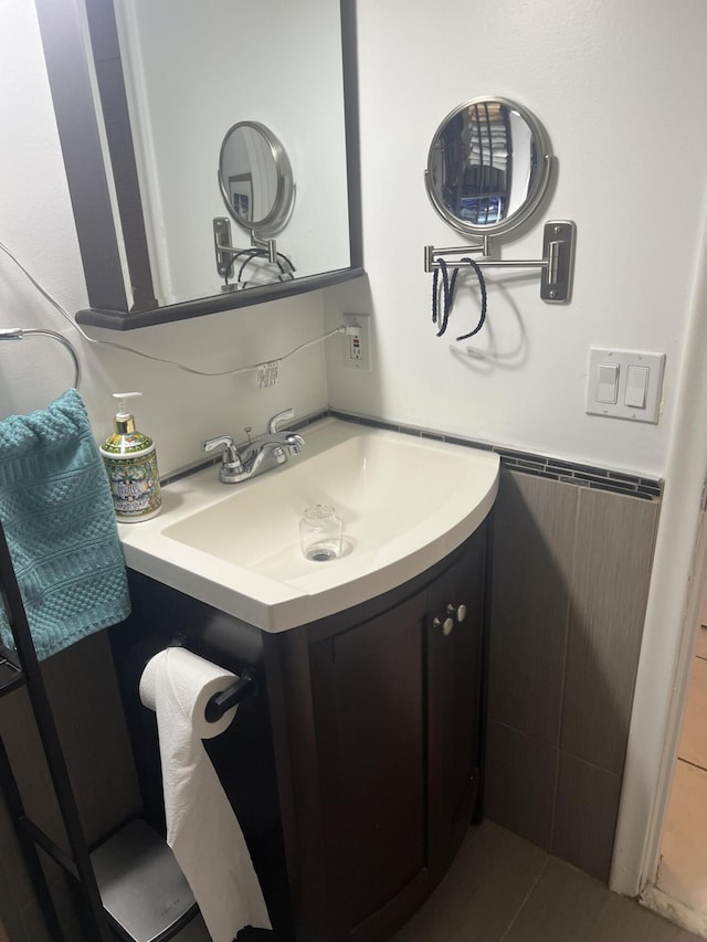 132 Berkshire F, West Palm Beach, FL 33417 - bathroom featuring vanity and wainscoting