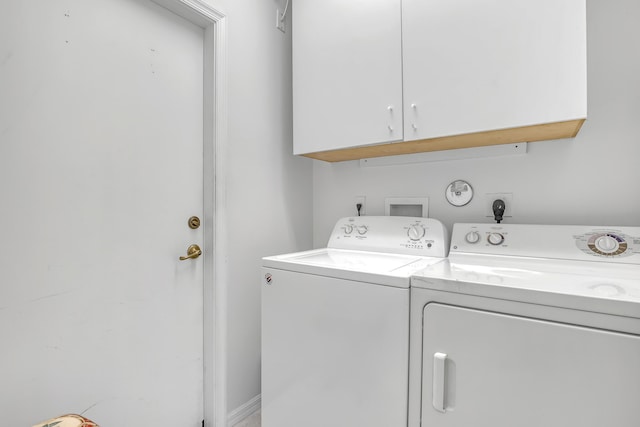 7703 Caprio Dr, Boynton Beach, FL 33472 - laundry area featuring independent washer and dryer and cabinet space