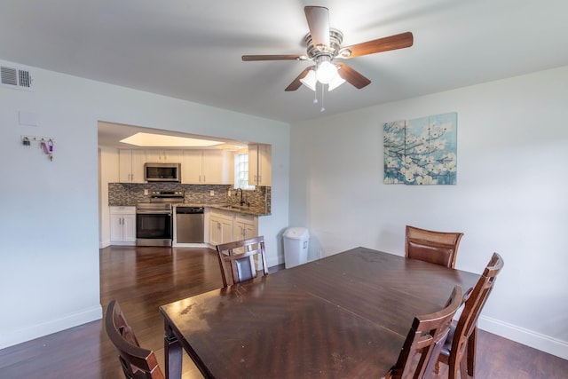 103 Weybridge C Cir Unit C, Royal Palm Beach, FL 33411 - dining space featuring dark wood-type flooring and a ceiling fan