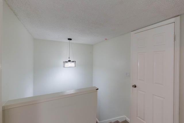 103 Weybridge C Cir Unit C, Royal Palm Beach, FL 33411 - corridor featuring a textured ceiling