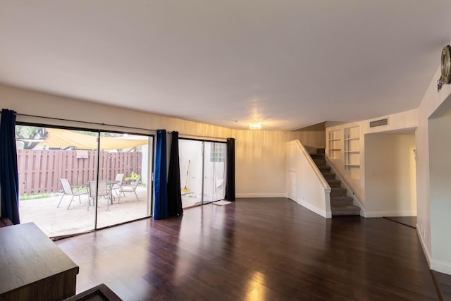 103 Weybridge C Cir Unit C, Royal Palm Beach, FL 33411 - unfurnished living room featuring stairway and wood finished floors