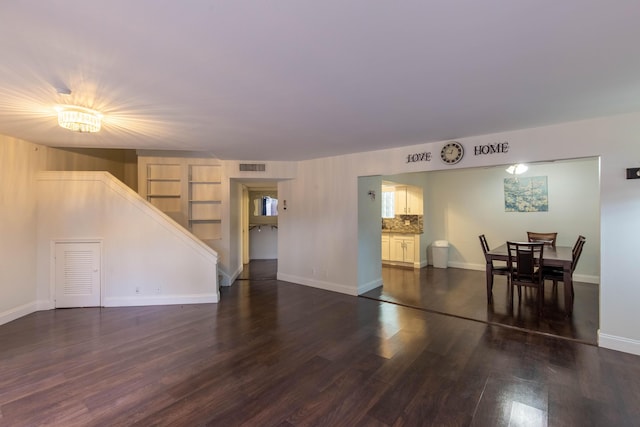 103 Weybridge C Cir Unit C, Royal Palm Beach, FL 33411 - living area with stairway and dark wood-type flooring