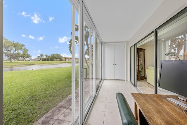 112 Piedmont C, Delray Beach, FL 33484 - unfurnished sunroom with a water view