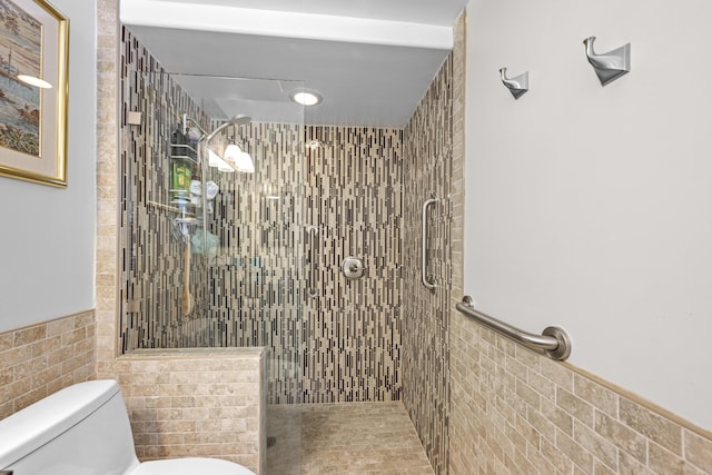 112 Piedmont C, Delray Beach, FL 33484 - full bathroom featuring tile walls, a tile shower, and wainscoting