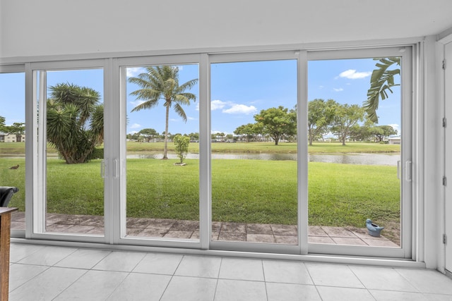 112 Piedmont C, Delray Beach, FL 33484 - doorway to outside featuring a water view and light tile patterned floors