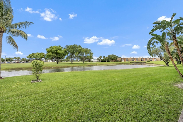 112 Piedmont C, Delray Beach, FL 33484 - view of green lawn featuring a water view