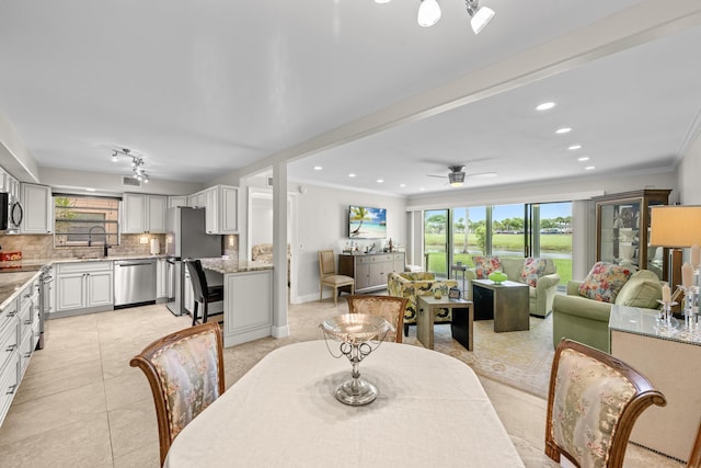 112 Piedmont C, Delray Beach, FL 33484 - dining area with plenty of natural light, crown molding, light tile patterned floors, a ceiling fan, and recessed lighting