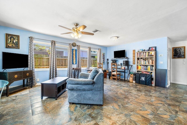 1405 N J Ter, Lake Worth Beach, FL 33460 - living area with ceiling fan and stone finish floors