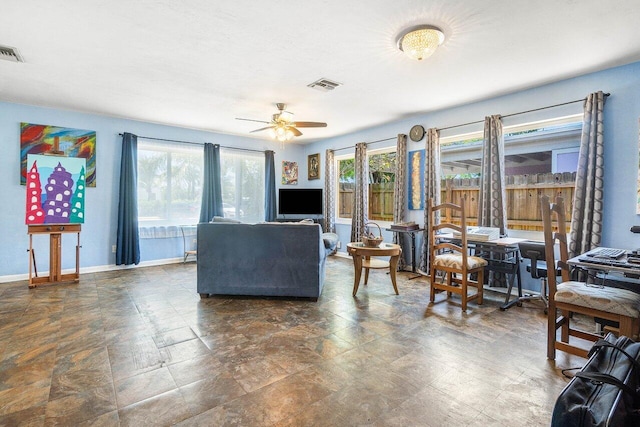 1405 N J Ter, Lake Worth Beach, FL 33460 - living area featuring a ceiling fan and stone finish flooring