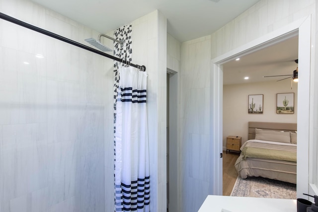 16932 W Aintree Dr W, Loxahatchee, FL 33470 - ensuite bathroom with a tile shower, ceiling fan, wood finished floors, and recessed lighting