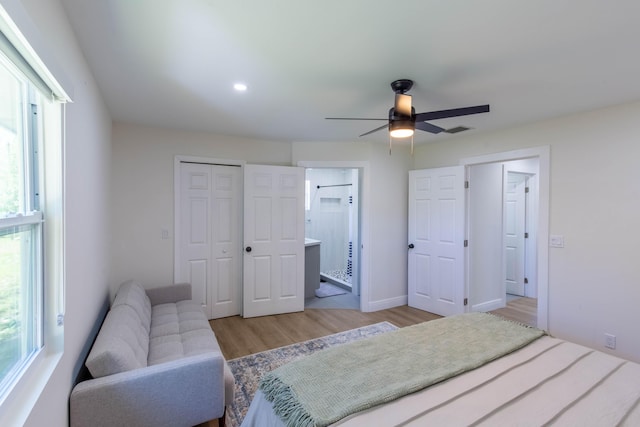 16932 W Aintree Dr W, Loxahatchee, FL 33470 - bedroom with light wood finished floors, a closet, recessed lighting, connected bathroom, and ceiling fan
