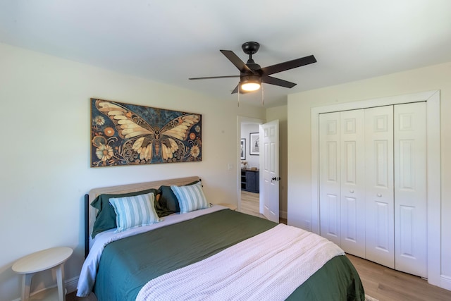 16932 W Aintree Dr W, Loxahatchee, FL 33470 - bedroom with light wood finished floors, a closet, and a ceiling fan