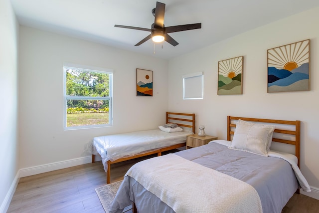 16932 W Aintree Dr W, Loxahatchee, FL 33470 - bedroom featuring wood finished floors, baseboards, and ceiling fan
