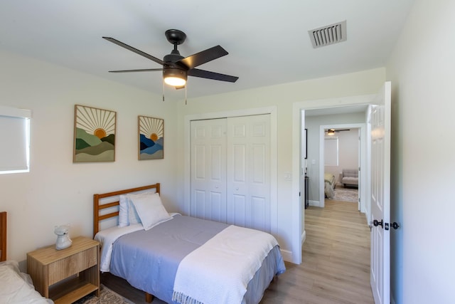 16932 W Aintree Dr W, Loxahatchee, FL 33470 - bedroom featuring light wood-style flooring, a closet, baseboards, and ceiling fan