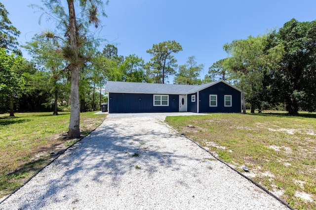 16932 W Aintree Dr W, Loxahatchee, FL 33470 - ranch-style home featuring driveway and a front lawn