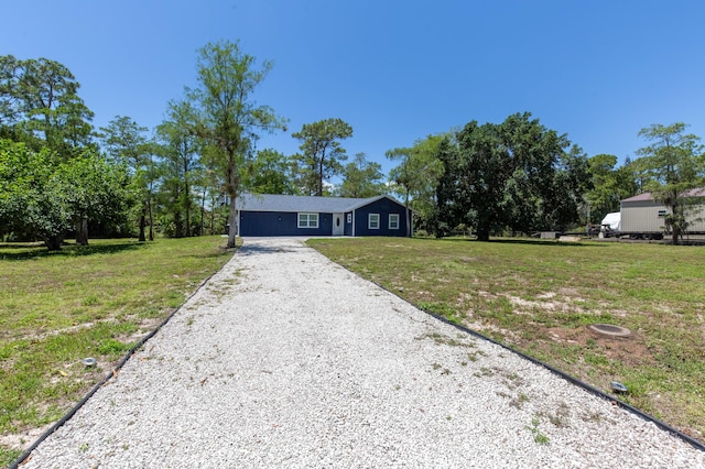 16932 W Aintree Dr W, Loxahatchee, FL 33470 - view of front of property with gravel driveway and a front lawn