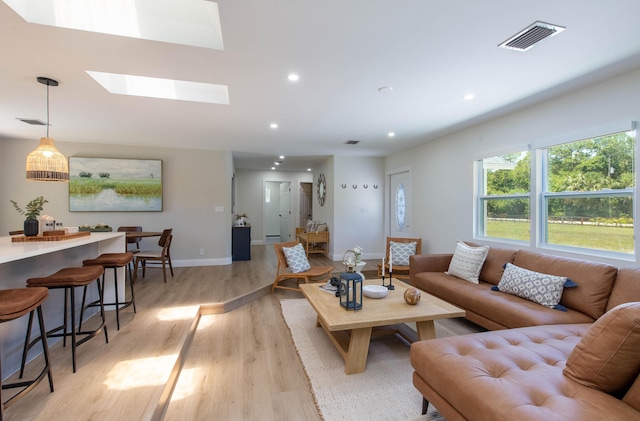16932 W Aintree Dr W, Loxahatchee, FL 33470 - living area featuring light wood-style floors, a skylight, baseboards, and recessed lighting
