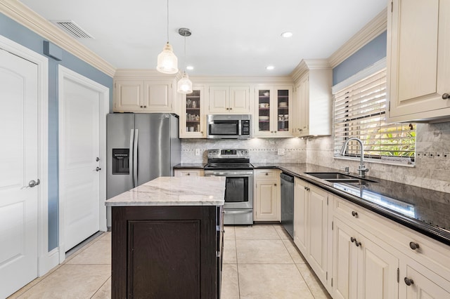 9950 Pyracantha Tree Ter Unit B, Boynton Beach, FL 33436 - kitchen with stainless steel appliances, a sink, tasteful backsplash, dark stone countertops, and hanging light fixtures