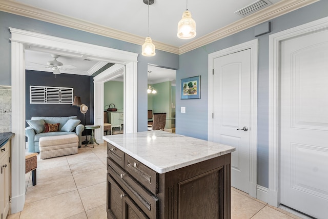 9950 Pyracantha Tree Ter Unit B, Boynton Beach, FL 33436 - kitchen featuring dark brown cabinets, light tile patterned floors, ornamental molding, hanging light fixtures, and light stone countertops