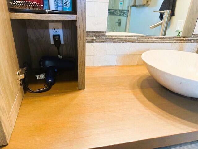 9950 Pyracantha Tree Ter Unit B, Boynton Beach, FL 33436 - bathroom featuring tile walls and a sink