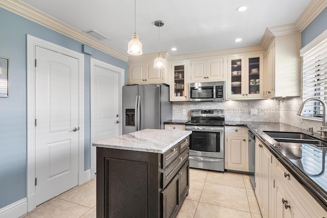9950 Pyracantha Tree Ter Unit B, Boynton Beach, FL 33436 - kitchen featuring stainless steel appliances, a sink, tasteful backsplash, dark stone countertops, and crown molding