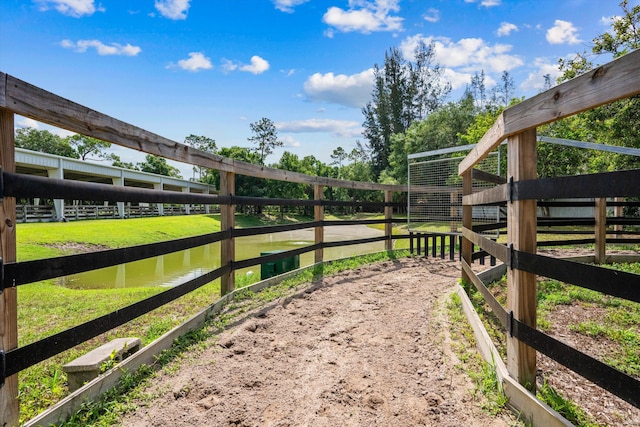 3442 C Rd, Loxahatchee Groves, FL 33470 - view of yard with an exterior structure, an outdoor structure, and a water view