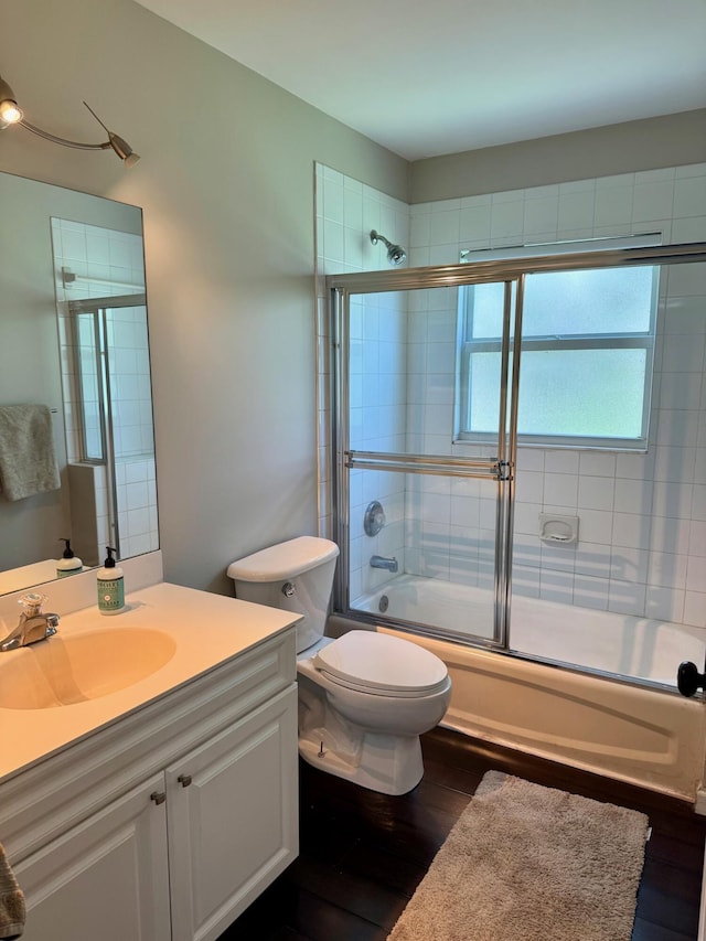 3442 C Rd, Loxahatchee Groves, FL 33470 - full bath with vanity, wood finished floors, and bath / shower combo with glass door
