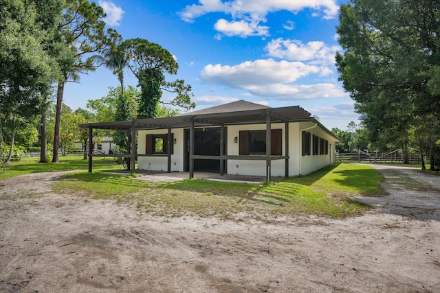 3442 C Rd, Loxahatchee Groves, FL 33470 - view of front of property with an exterior structure and stucco siding