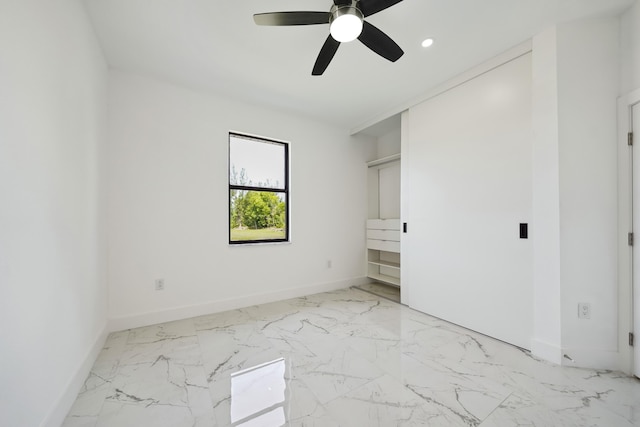 418 NE 31st Ter, Cape Coral, FL 33909 - unfurnished bedroom featuring light marble finish floors, baseboards, recessed lighting, and ceiling fan