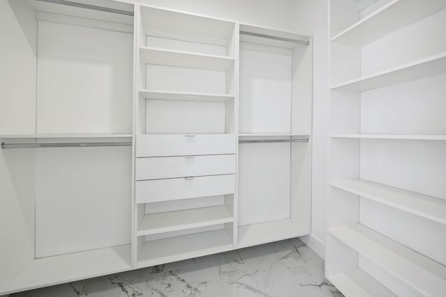 418 NE 31st Ter, Cape Coral, FL 33909 - walk in closet featuring light marble finish flooring