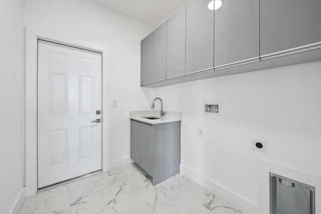418 NE 31st Ter, Cape Coral, FL 33909 - washroom with electric dryer hookup, baseboards, cabinet space, light marble finish flooring, and hookup for a washing machine