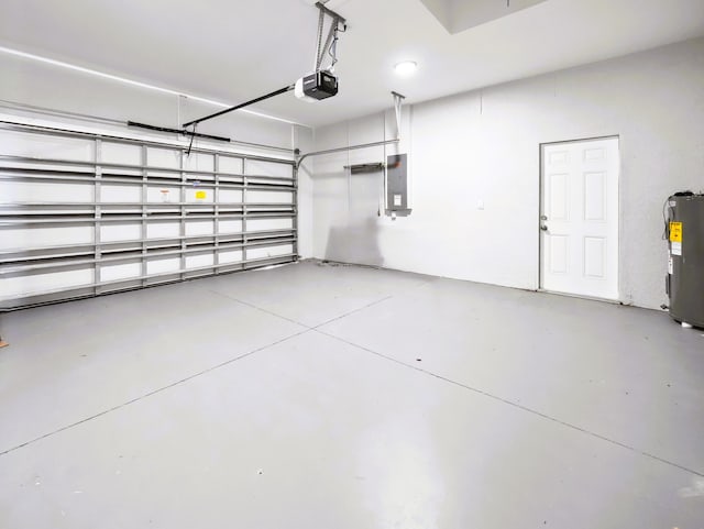 418 NE 31st Ter, Cape Coral, FL 33909 - garage featuring electric panel, electric water heater, and a garage door opener
